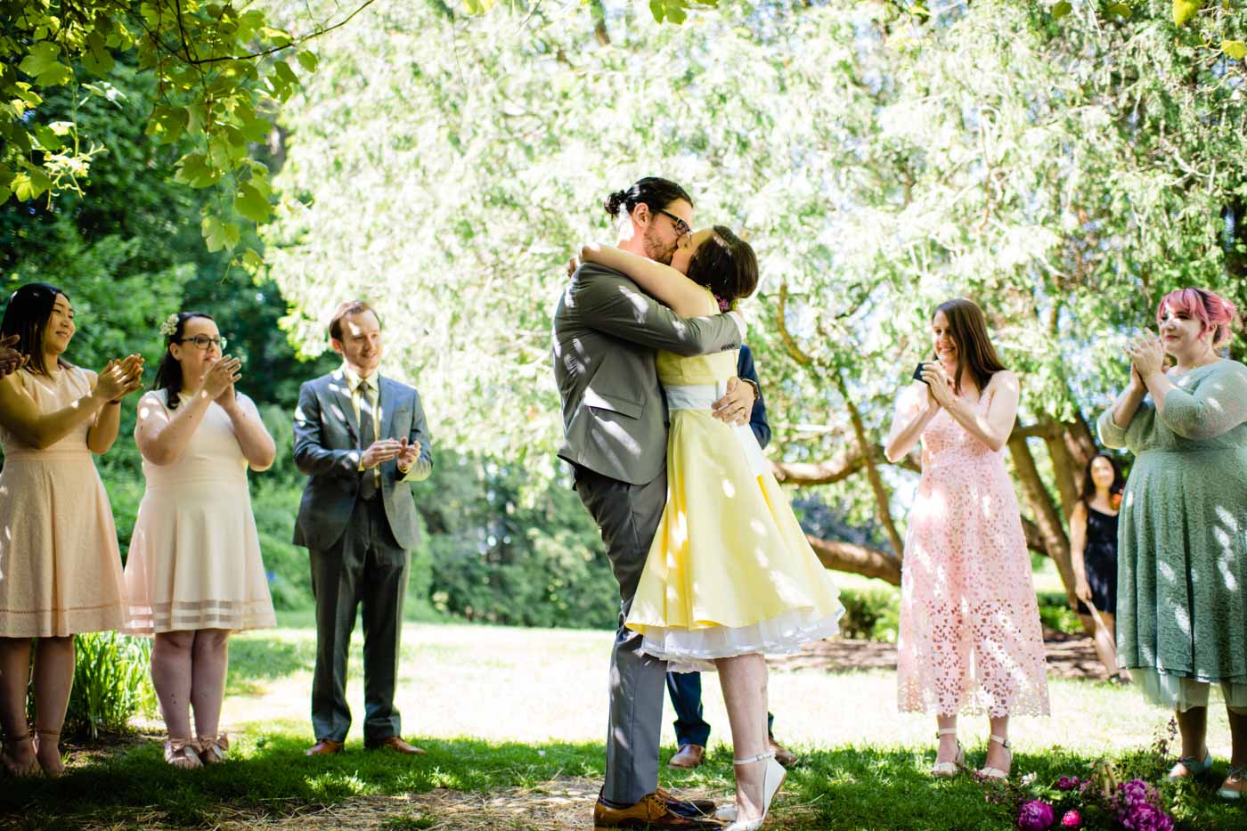 Wedding Traditions bride-groom-kissing-after-ceremony-in-garden