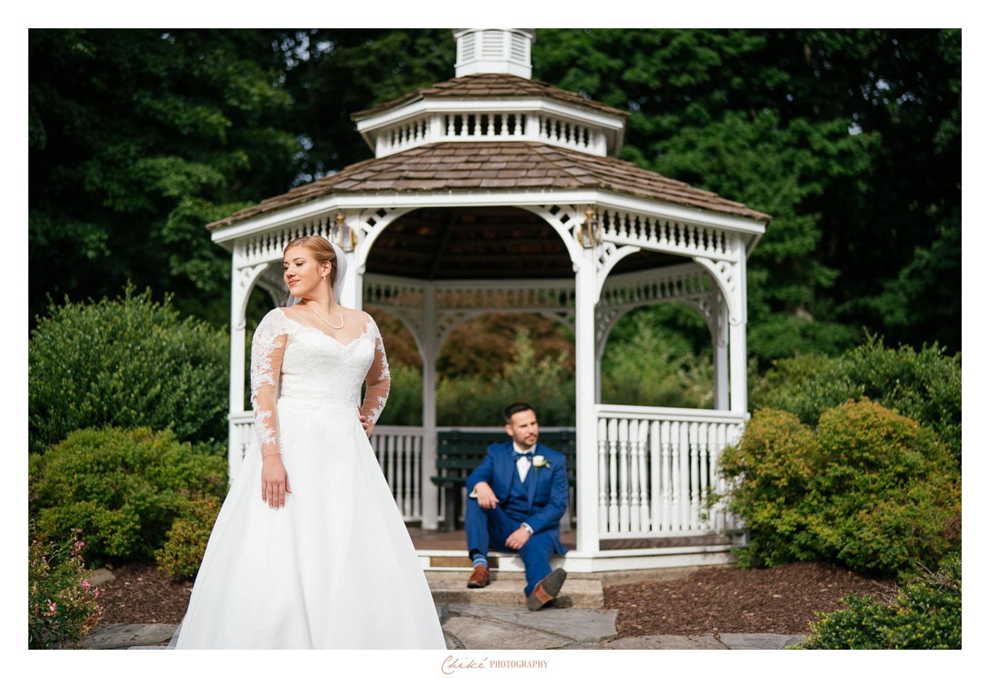 College Graduates Wed groom sitting on gazebo steps with bride in front