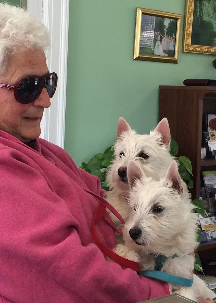 Park Lover and Friend eleanor holding her two white terrier pups